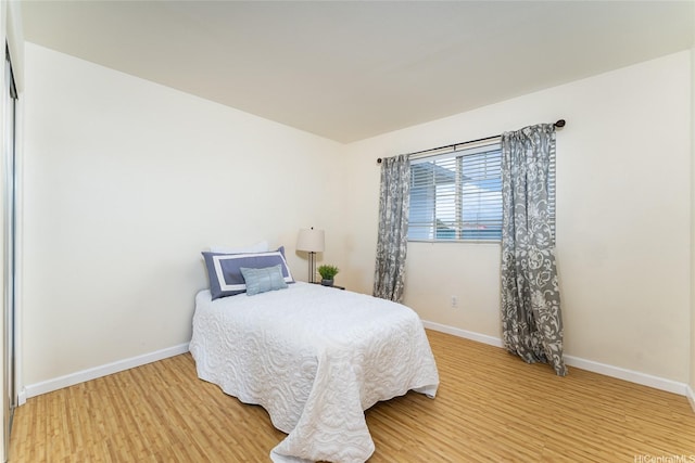 91-1031 Kaimalie St Unit 4P4, Ewa Beach, HI 96706 - bedroom featuring light wood-style floors and baseboards