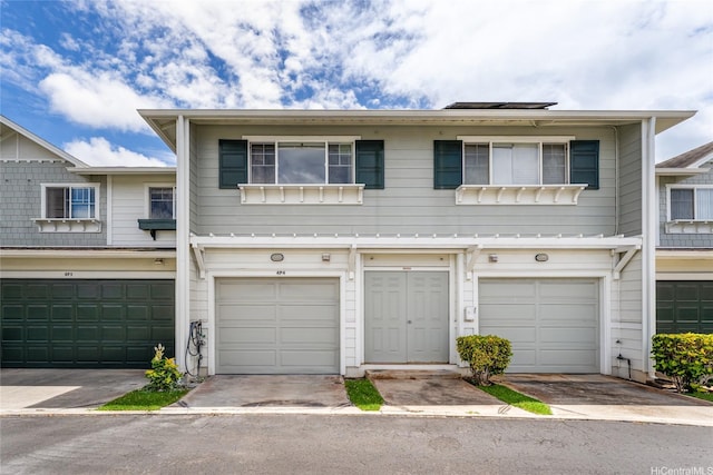 91-1031 Kaimalie St Unit 4P4, Ewa Beach, HI 96706 - view of property with an attached garage