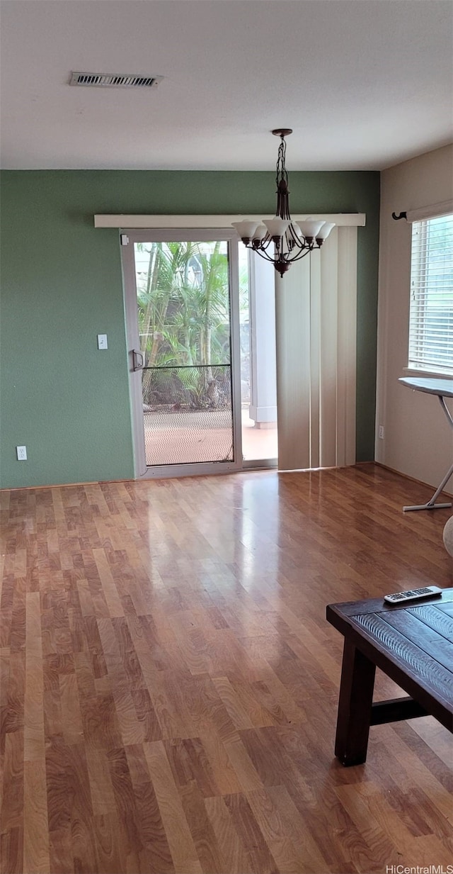 92-1366PUNAWAINUIST Punawainui St, Kapolei, HI 96707 - unfurnished dining area with a chandelier and wood finished floors