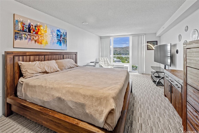 7000 Hawaii Kai Dr Unit 2702, Honolulu, HI 96825 - bedroom with carpet flooring and a textured ceiling