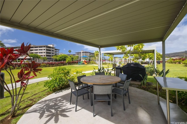 7000 Hawaii Kai Dr Unit 2702, Honolulu, HI 96825 - view of patio featuring a playground, outdoor dining space, and area for grilling
