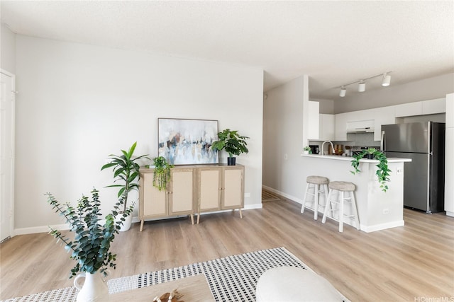 91-1059 Puaniu St Unit 21T, Ewa Beach, HI 96706 - living area with light wood finished floors and baseboards