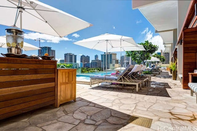 383 Kalaimoku St Unit E1111, Honolulu, HI 96815 - view of patio with a skyline view