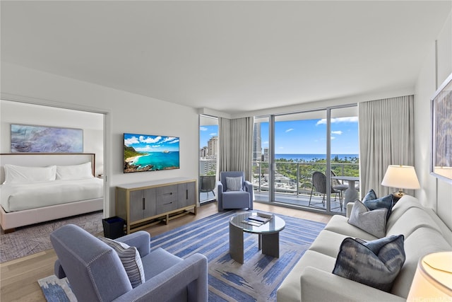 383 Kalaimoku St Unit E1111, Honolulu, HI 96815 - living room featuring wood finished floors and expansive windows