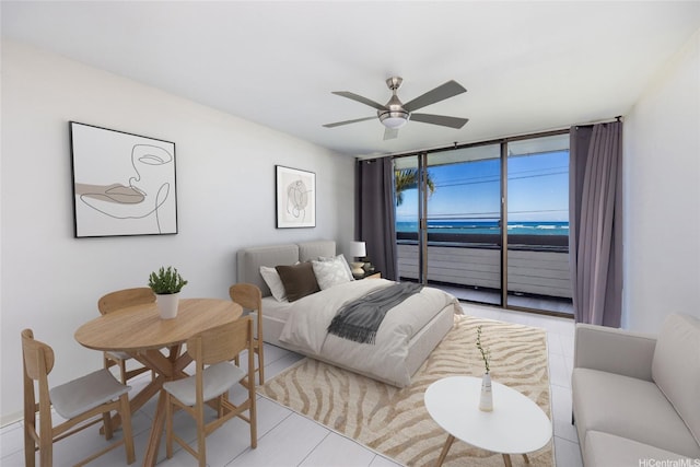 51-636 Kamehameha Hwy Unit 115, Kaaawa, HI 96730 - tiled bedroom with access to exterior, a water view, and ceiling fan