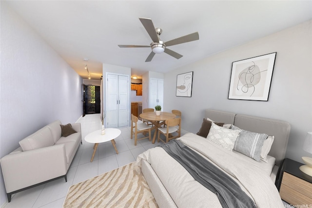 51-636 Kamehameha Hwy Unit 115, Kaaawa, HI 96730 - bedroom with light tile patterned floors, connected bathroom, and ceiling fan