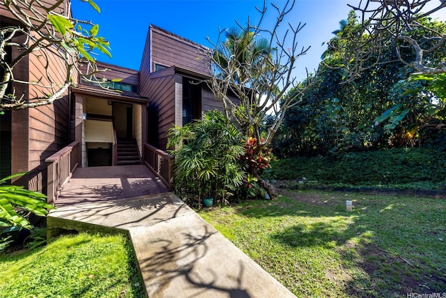 51-636 Kamehameha Hwy Unit 115, Kaaawa, HI 96730 - view of property exterior featuring a lawn