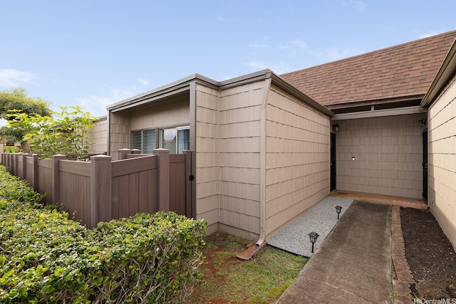 94-423 Keaoopua St Unit 155, Mililani, HI 96789 - view of side of home featuring a shingled roof