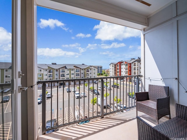 91-3641 Iwikuamoo St Unit 9408, Ewa Beach, HI 96706 - balcony featuring ceiling fan and a residential view