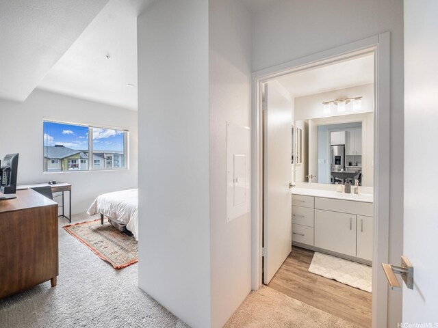 91-3641 Iwikuamoo St Unit 9408, Ewa Beach, HI 96706 - ensuite bathroom with wood finished floors and vanity