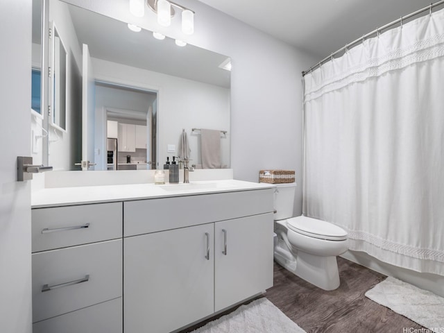 91-3641 Iwikuamoo St Unit 9408, Ewa Beach, HI 96706 - bathroom featuring wood finished floors, toilet, vanity, and a shower with shower curtain