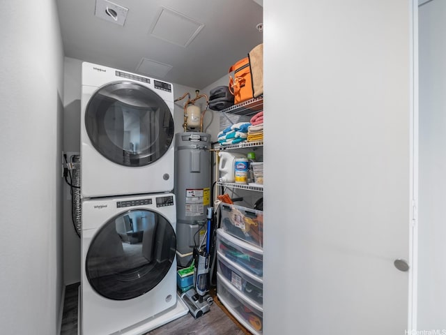 91-3641 Iwikuamoo St Unit 9408, Ewa Beach, HI 96706 - clothes washing area with stacked washer / drying machine, attic access, wood finished floors, and electric water heater