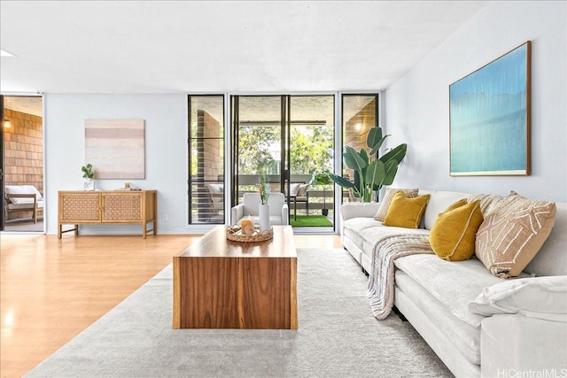 333 Aoloa St Unit 329, Kailua, HI 96734 - living area featuring wood finished floors and a wall of windows