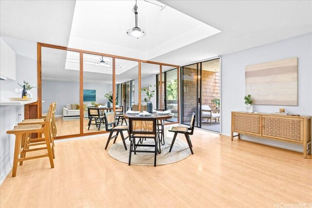 333 Aoloa St Unit 329, Kailua, HI 96734 - dining space featuring floor to ceiling windows, light wood-style floors, and a ceiling fan