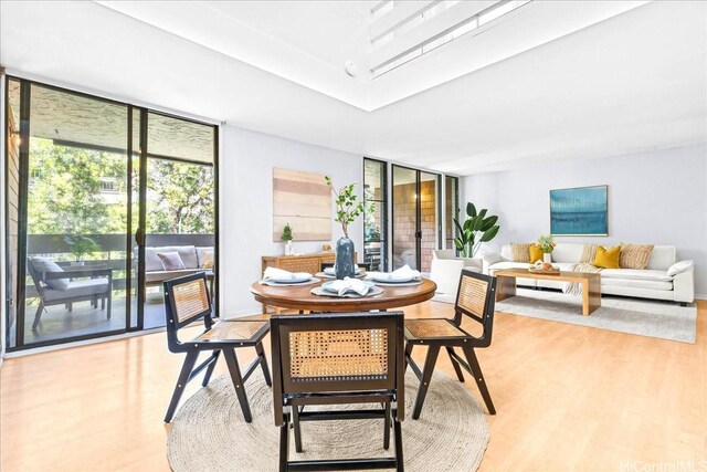 333 Aoloa St Unit 329, Kailua, HI 96734 - dining room featuring expansive windows and light wood-type flooring