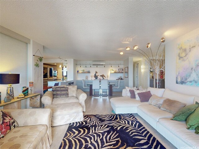1015 Wilder Ave Unit 1003, Honolulu, HI 96822 - living room featuring wood finished floors and a textured ceiling