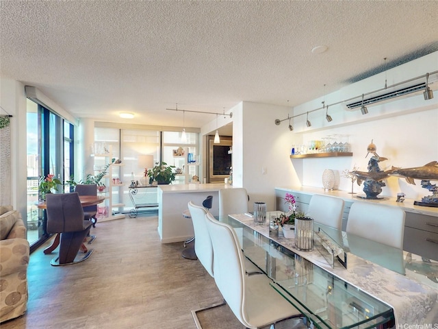 1015 Wilder Ave Unit 1003, Honolulu, HI 96822 - dining area with wood finished floors and a textured ceiling