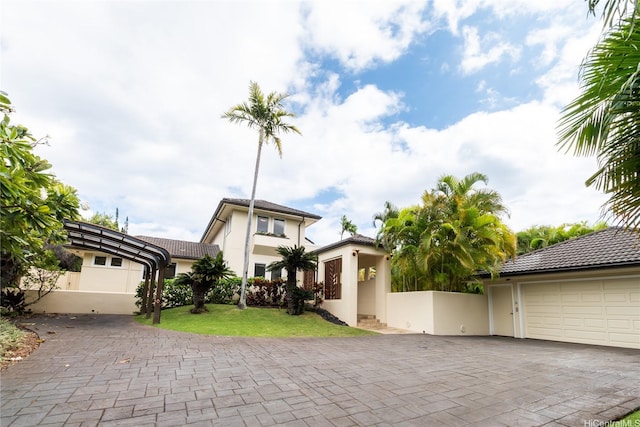 769 Elepaio St, Honolulu, HI 96816 - view of front facade with stucco siding, a tile roof, and decorative driveway