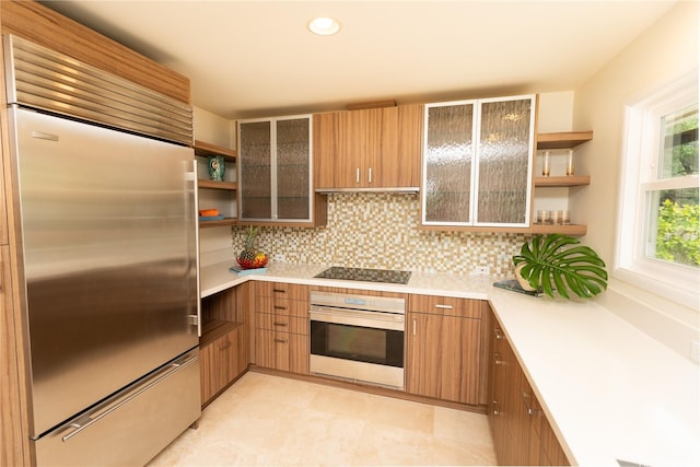 769 Elepaio St, Honolulu, HI 96816 - kitchen with stainless steel appliances, open shelves, light countertops, tasteful backsplash, and glass insert cabinets