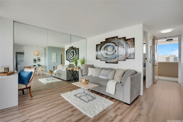 2121 Ala Wai Blvd Unit 4106, Honolulu, HI 96815 - living room featuring light wood finished floors