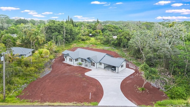 view of subject property with a forest