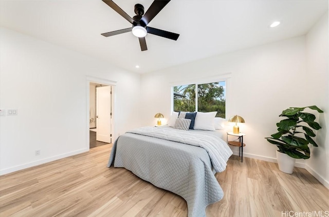 bedroom with light wood-style flooring, baseboards, recessed lighting, ceiling fan, and ensuite bathroom
