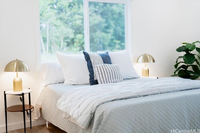bedroom with wood finished floors