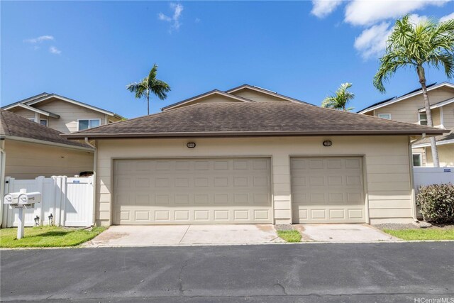 91-1104 Kaileonui St, Ewa Beach, HI 96706 - ranch-style home with an attached garage, roof with shingles, and driveway
