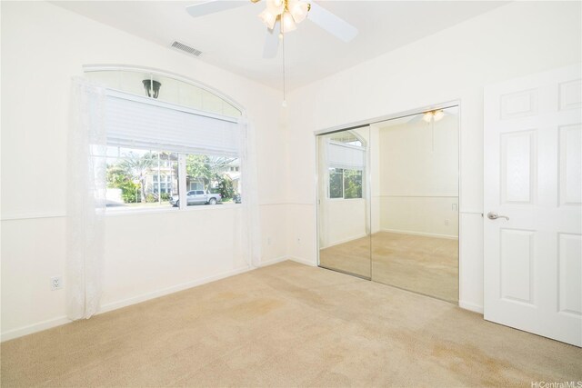 91-1104 Kaileonui St, Ewa Beach, HI 96706 - unfurnished bedroom with carpet, a closet, a ceiling fan, and baseboards