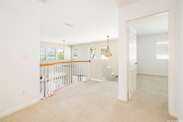 91-1104 Kaileonui St, Ewa Beach, HI 96706 - hallway with carpet flooring, an upstairs landing, and baseboards