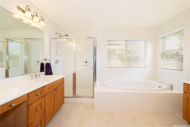 91-1104 Kaileonui St, Ewa Beach, HI 96706 - bathroom with vanity, a stall shower, a garden tub, and tile patterned floors