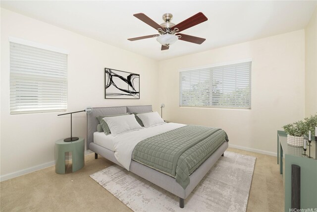 91-1104 Kaileonui St, Ewa Beach, HI 96706 - bedroom with light colored carpet, baseboards, and a ceiling fan