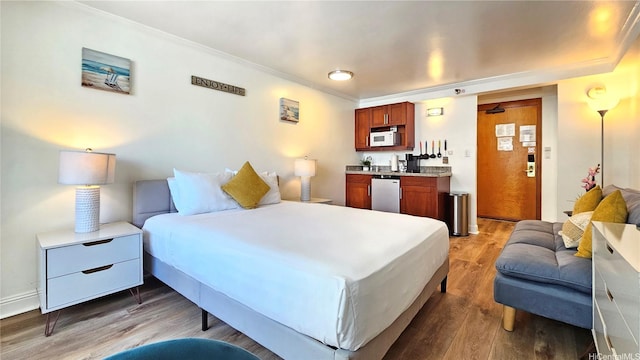 2425 Kuhio Ave Unit 603, Honolulu, HI 96815 - bedroom featuring wood finished floors and ornamental molding
