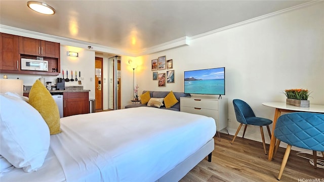 2425 Kuhio Ave Unit 603, Honolulu, HI 96815 - bedroom featuring ornamental molding, wood finished floors, and baseboards