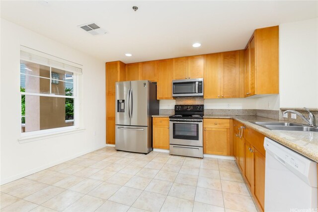 520 Lunalilo Home Rd Unit 7121, Honolulu, HI 96825 - kitchen with stainless steel appliances, a sink, light stone countertops, baseboards, and recessed lighting