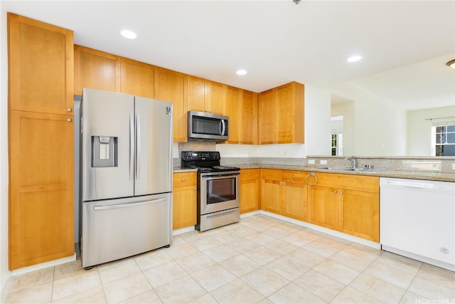520 Lunalilo Home Rd Unit 7121, Honolulu, HI 96825 - kitchen with stainless steel appliances, a sink, light stone counters, recessed lighting, and light tile patterned floors
