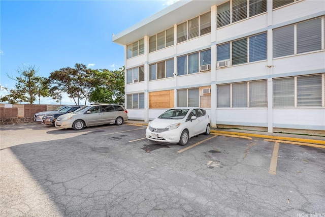94-249 Waikele Rd Unit A205, Waipahu, HI 96797 - view of building exterior featuring uncovered parking