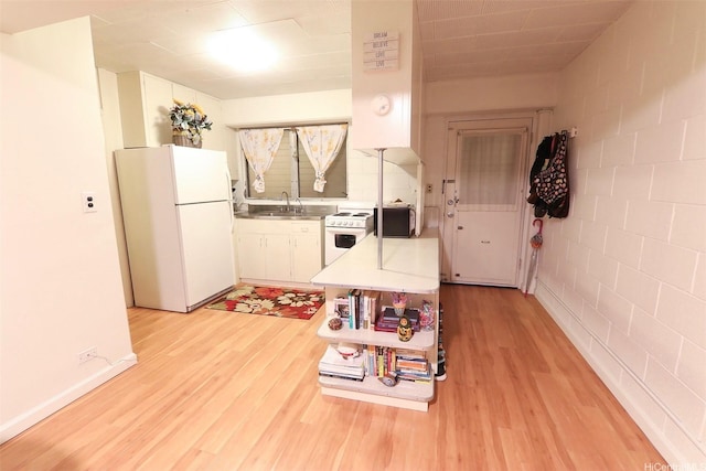2626 Kuilei St Unit K, Honolulu, HI 96826 - kitchen with white appliances, light wood-type flooring, a sink, and white cabinets
