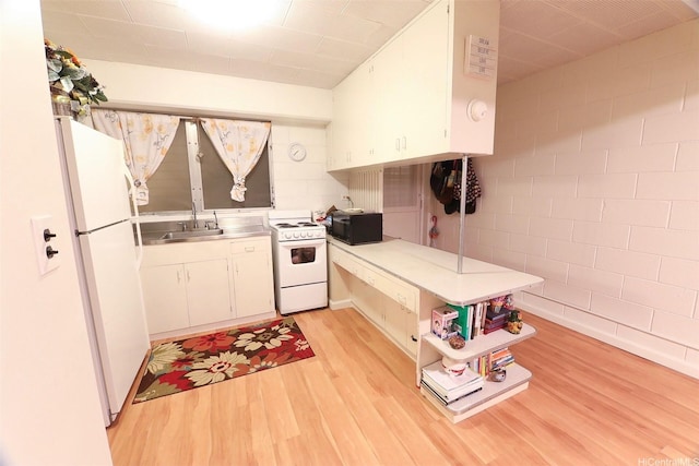 2626 Kuilei St Unit K, Honolulu, HI 96826 - kitchen with white appliances, light wood finished floors, white cabinetry, a sink, and stainless steel countertops