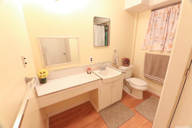 2626 Kuilei St Unit K, Honolulu, HI 96826 - bathroom with wood finished floors, toilet, and vanity