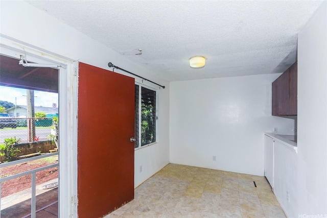1313 Whitmore Ave, Wahiawa, HI 96786 - spare room featuring a textured ceiling