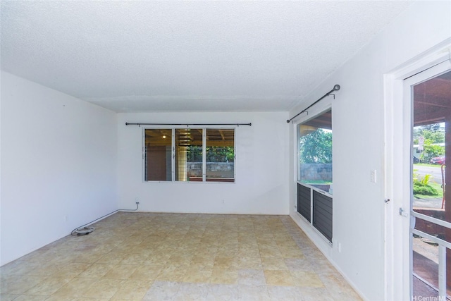 1313 Whitmore Ave, Wahiawa, HI 96786 - spare room with a textured ceiling and healthy amount of natural light