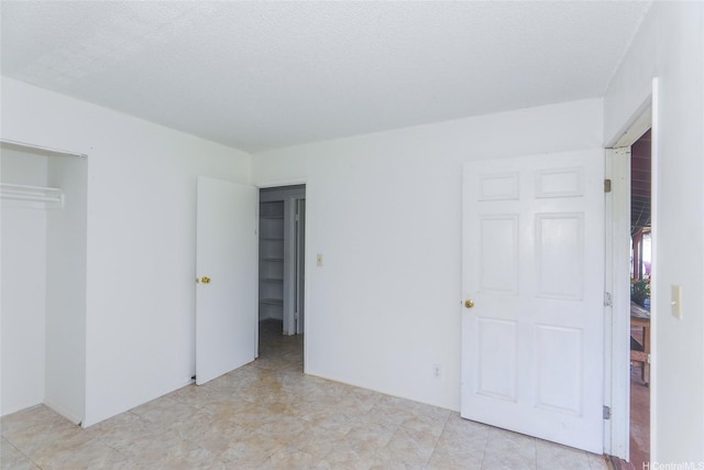 1313 Whitmore Ave, Wahiawa, HI 96786 - unfurnished bedroom featuring a closet and a textured ceiling
