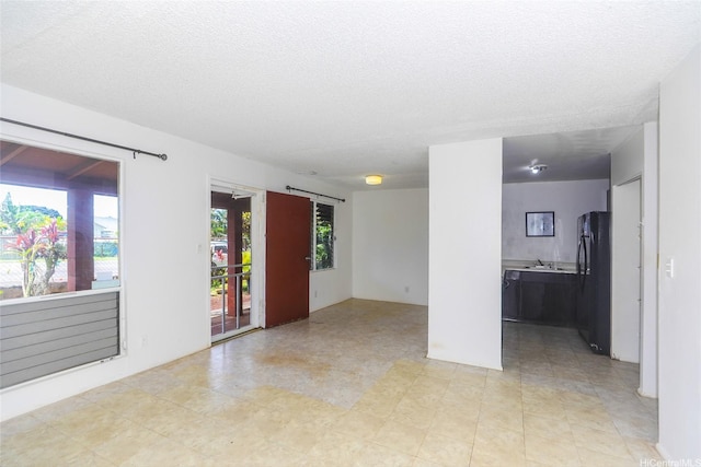 1313 Whitmore Ave, Wahiawa, HI 96786 - empty room with a sink and a textured ceiling