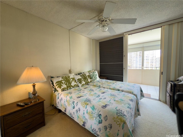 425 Ena Rd Unit 1201B, Honolulu, HI 96815 - bedroom featuring carpet floors, access to exterior, a textured ceiling, and a ceiling fan