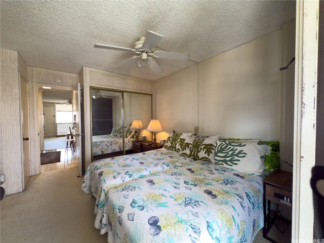425 Ena Rd Unit 1201B, Honolulu, HI 96815 - bedroom with carpet flooring, a closet, a textured ceiling, and a ceiling fan