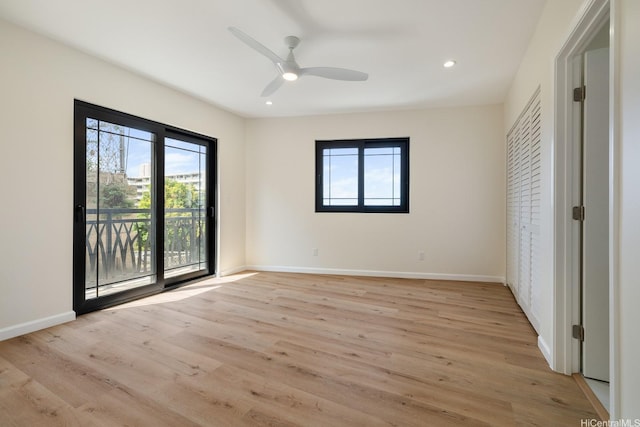 332 Iolani Ave, Honolulu, HI 96813 - unfurnished bedroom with multiple windows, light wood finished floors, baseboards, access to outside, and recessed lighting