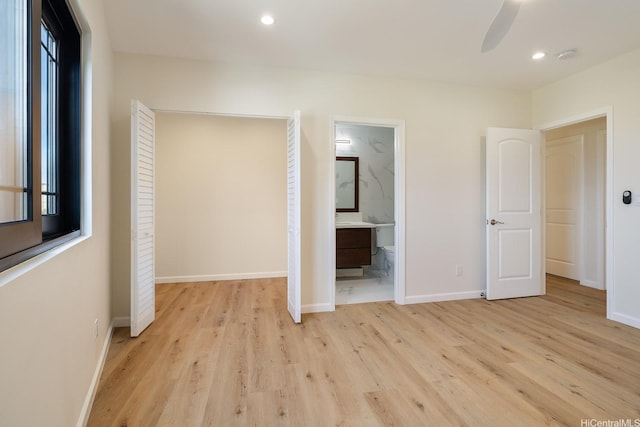 332 Iolani Ave, Honolulu, HI 96813 - unfurnished bedroom featuring light wood-type flooring, baseboards, recessed lighting, and ensuite bath