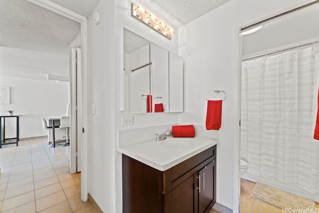 2452 Tusitala St Unit 1101, Honolulu, HI 96815 - full bath with a textured ceiling, tile patterned flooring, vanity, toilet, and a shower with shower curtain