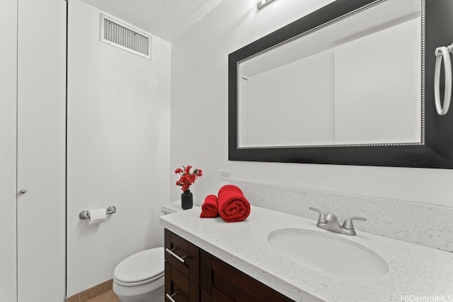 2452 Tusitala St Unit 1101, Honolulu, HI 96815 - bathroom featuring vanity, toilet, and a textured ceiling